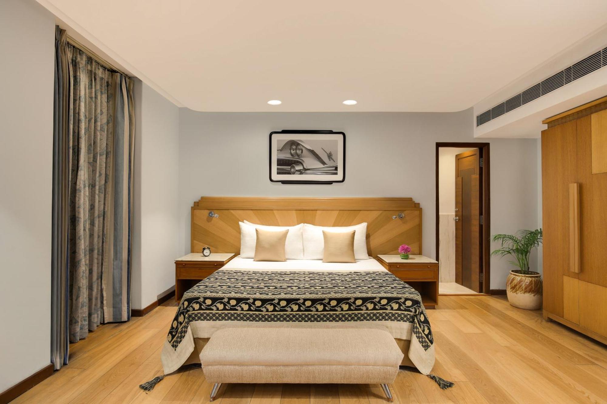 Ambassador, New Delhi - Ihcl Seleqtions Hotel Kültér fotó A bedroom at the Taj Bengal